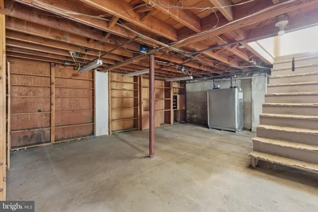 a view of empty room with white walls