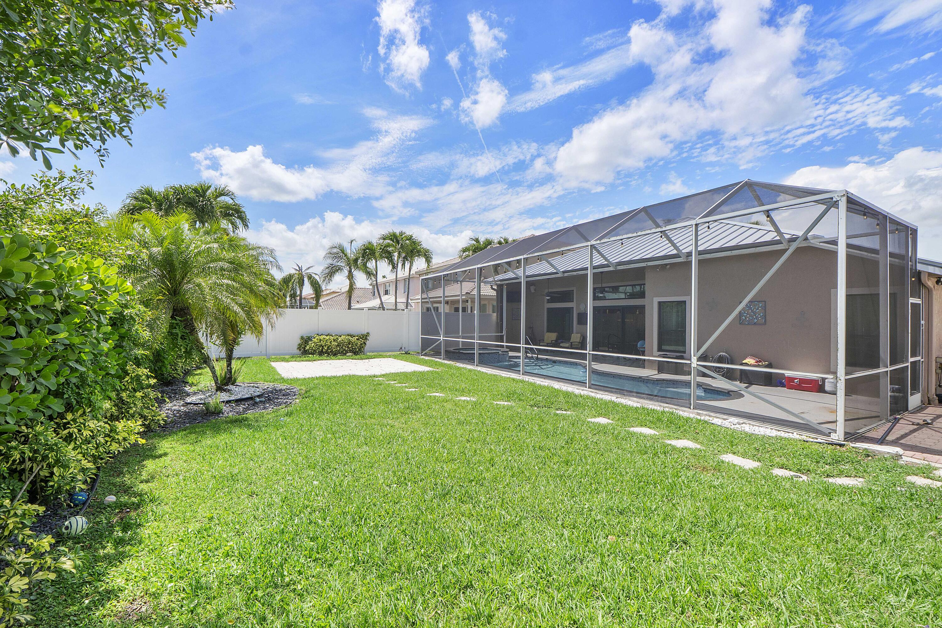 12328 St Simon Drive Boca Raton, FL 33428 - Photo 36 of 52 a view of a house with backyard and sitting area