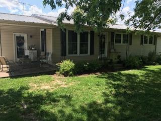 489 Ab Wade Road Portland, TN 37148 - Photo 1 of 23 a view of backyard with potted plants and a table and chairs