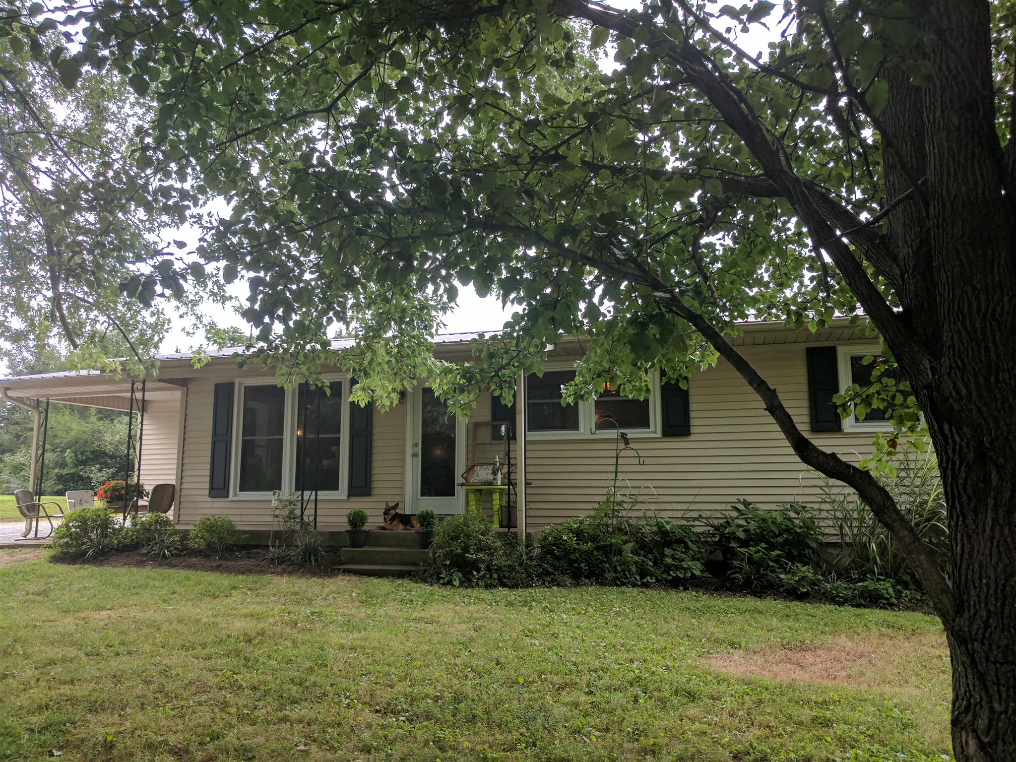 489 Ab Wade Road Portland, TN 37148 - Photo 23 of 23 a front view of a house with garden