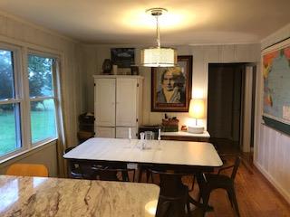 489 Ab Wade Road Portland, TN 37148 - Photo 5 of 23 a kitchen with a table chairs and refrigerator