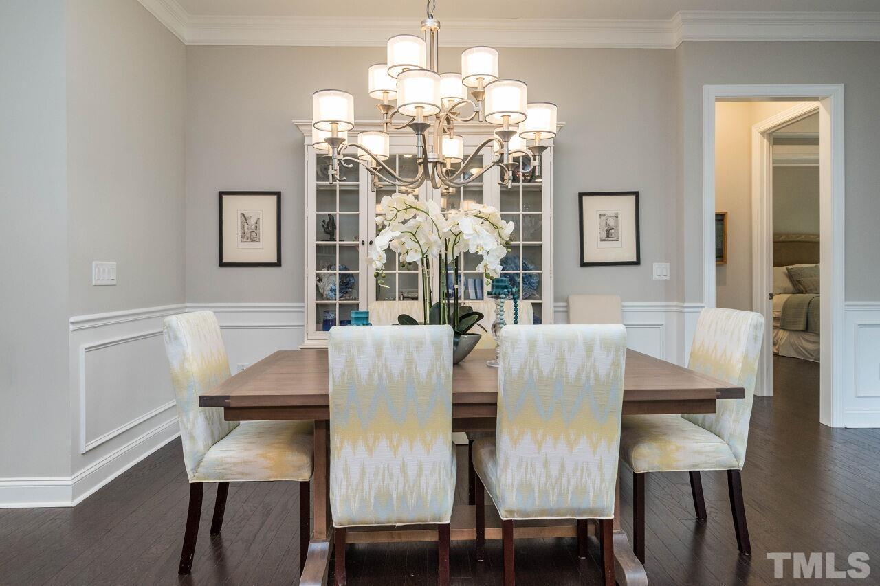 129 Damsire Way Cary, NC 27513 - Photo 12 of 32 a view of a dining room with furniture and chandelier