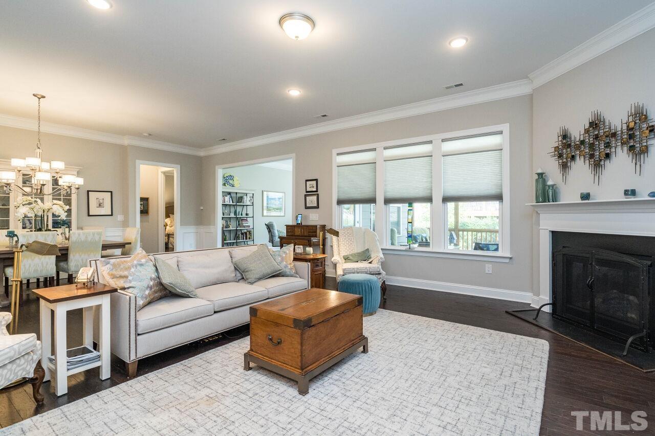 129 Damsire Way Cary, NC 27513 - Photo 14 of 32 a living room with furniture and a fireplace