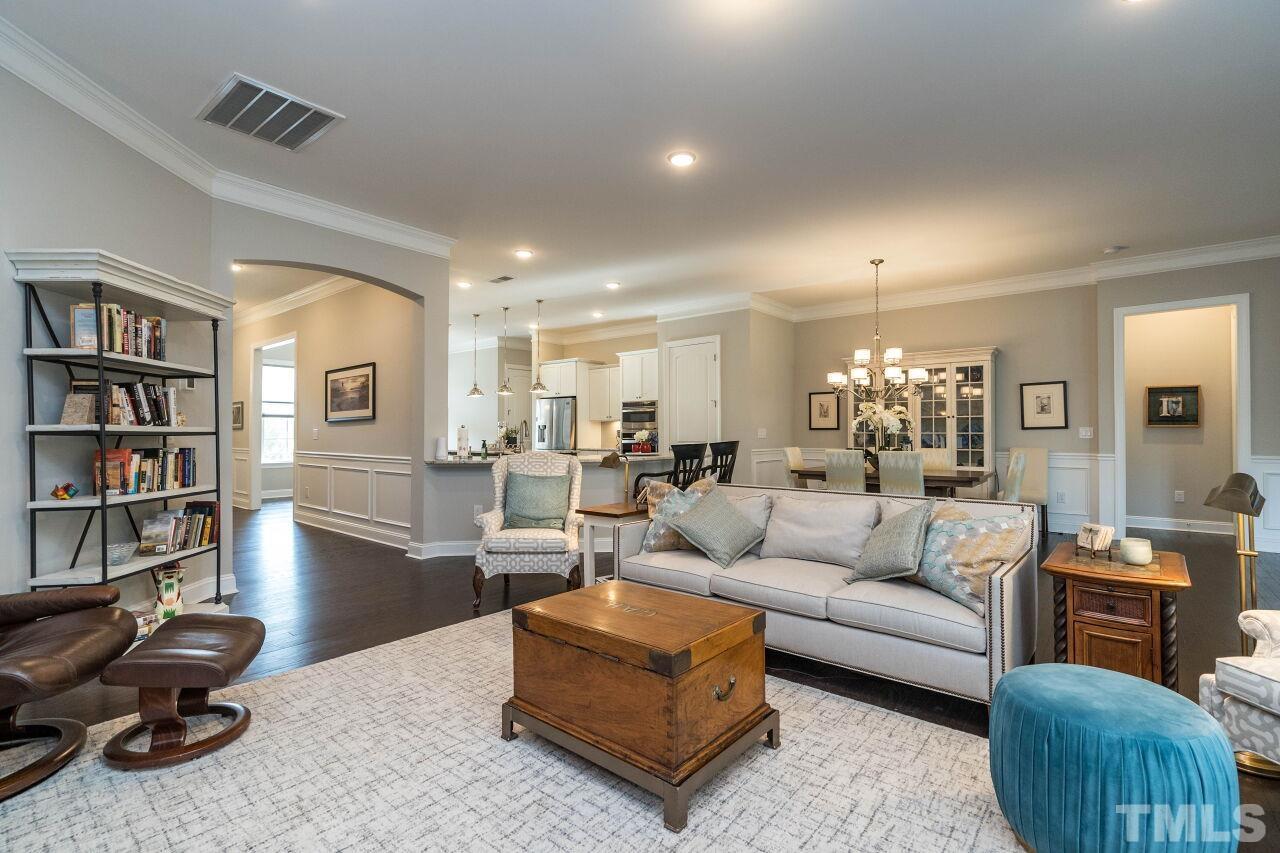 129 Damsire Way Cary, NC 27513 - Photo 15 of 32 a living room with furniture and a book shelf
