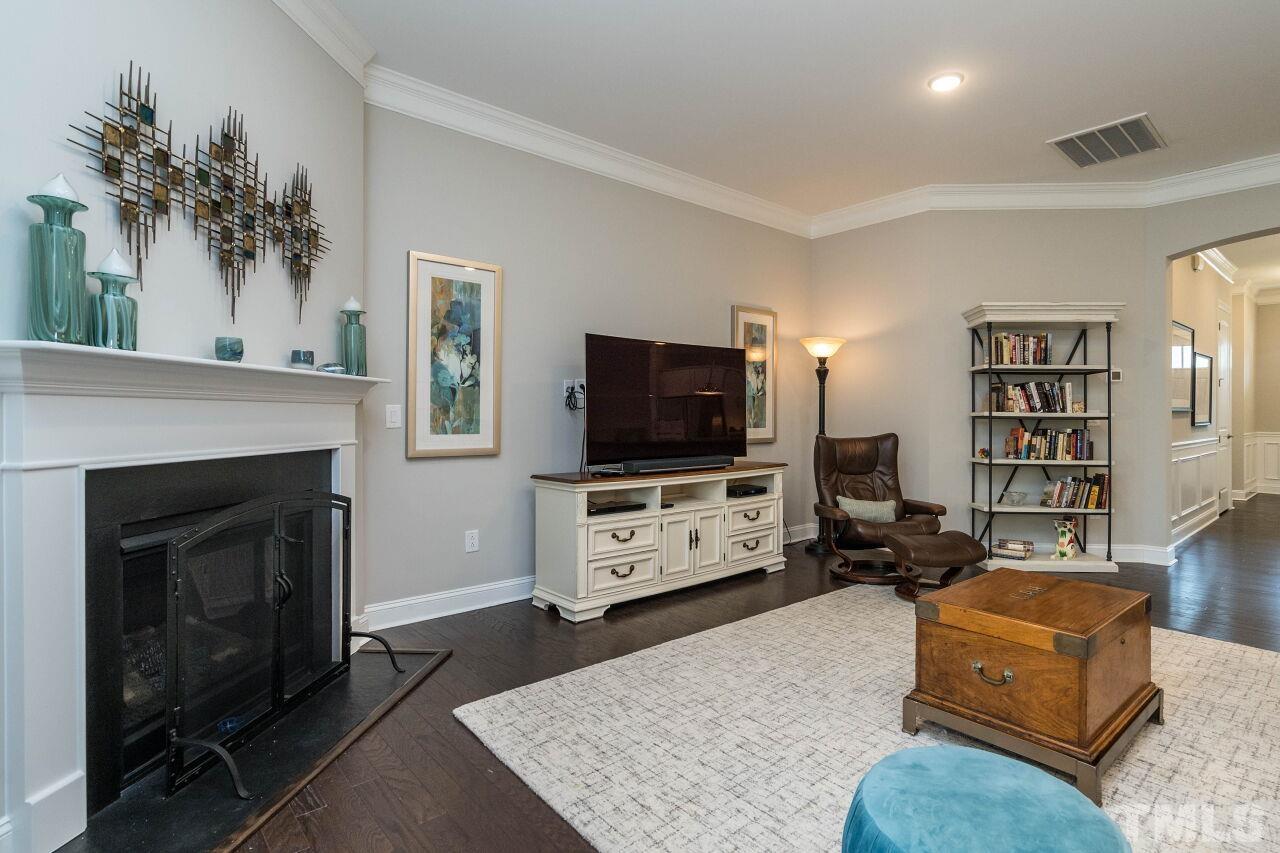 129 Damsire Way Cary, NC 27513 - Photo 16 of 32 a living room with furniture and a flat screen tv