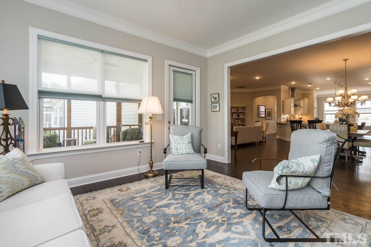 129 Damsire Way Cary, NC 27513 - Photo 18 of 32 a living room with furniture and a large window