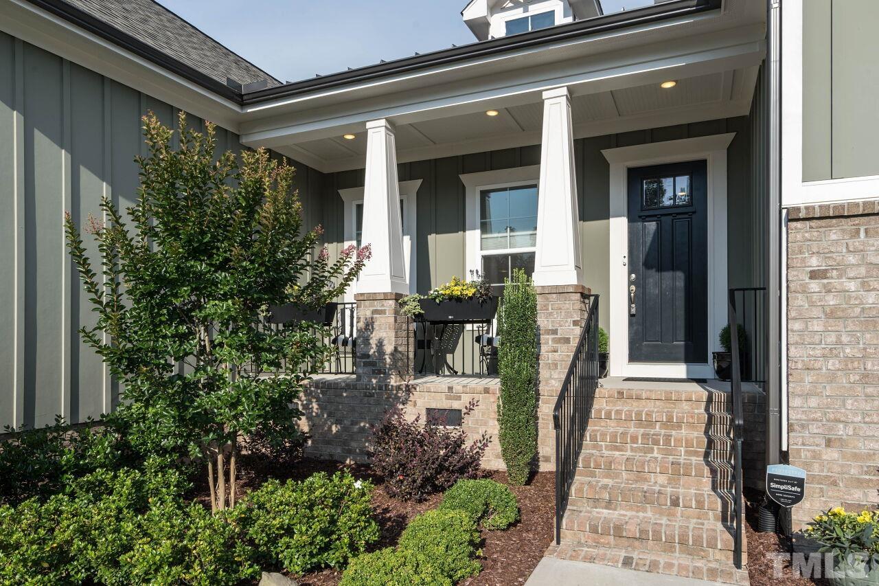 129 Damsire Way Cary, NC 27513 - Photo 2 of 32 a front view of a house with garden