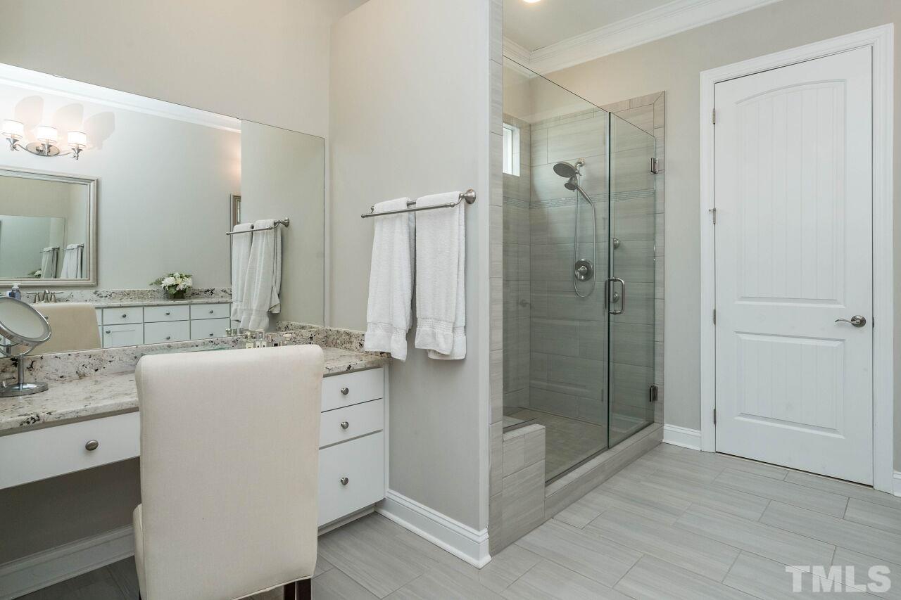 129 Damsire Way Cary, NC 27513 - Photo 22 of 32 a bathroom with a double vanity sink mirror and shower