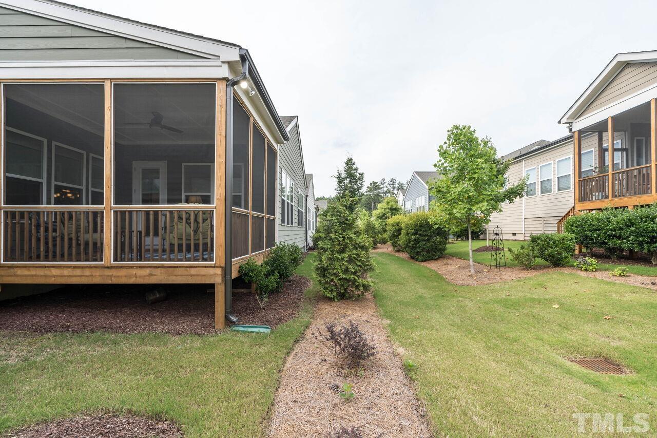 129 Damsire Way Cary, NC 27513 - Photo 30 of 32 a view of a house with backyard porch and sitting area