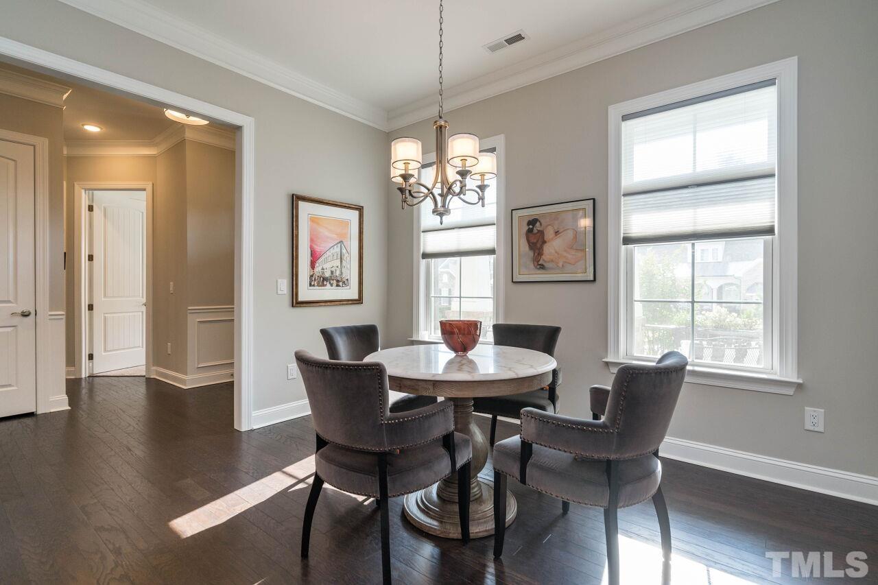 129 Damsire Way Cary, NC 27513 - Photo 5 of 32 a view of a dining room with furniture window and wooden floor