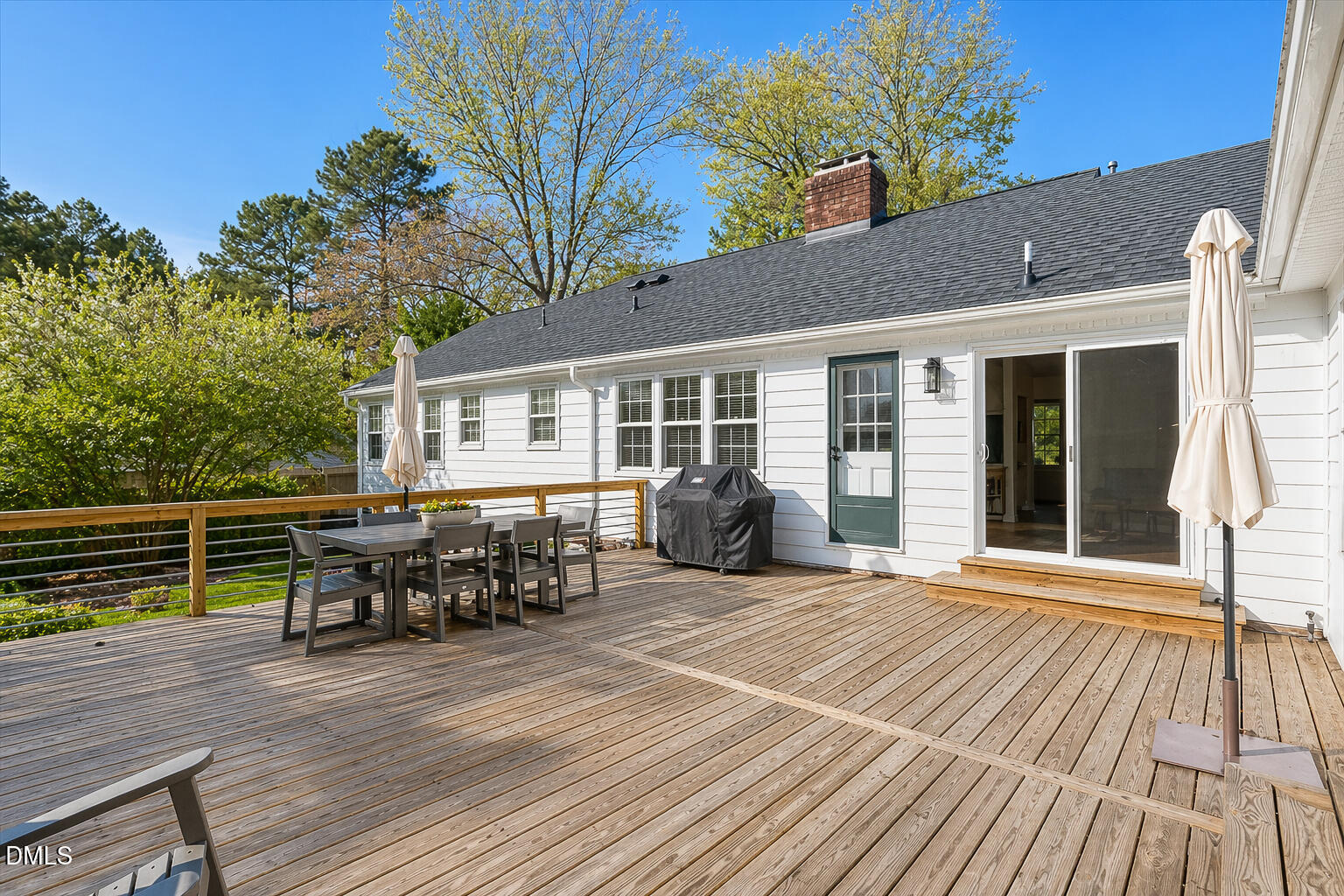 5904 Volant Drive Raleigh, NC 27609 - Photo 36 of 42 a view of a house with a patio and a yard