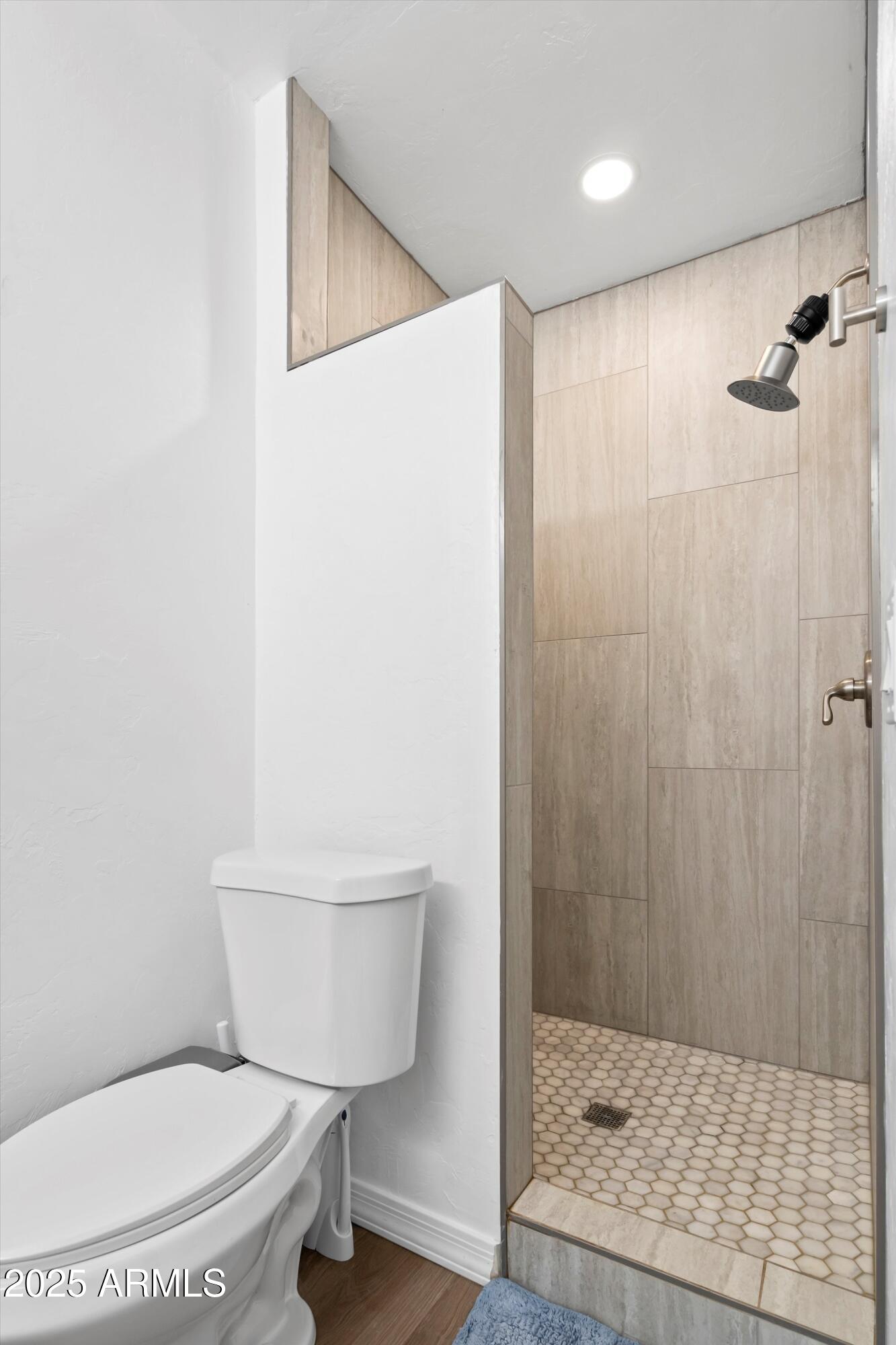 468 West Duane Street Benson, AZ 85602 - Photo 11 of 21 a bathroom with a toilet and a shower