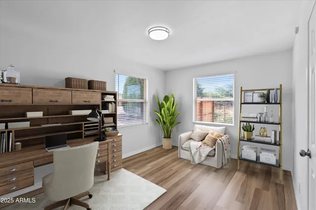 a living room with furniture and a book shelf