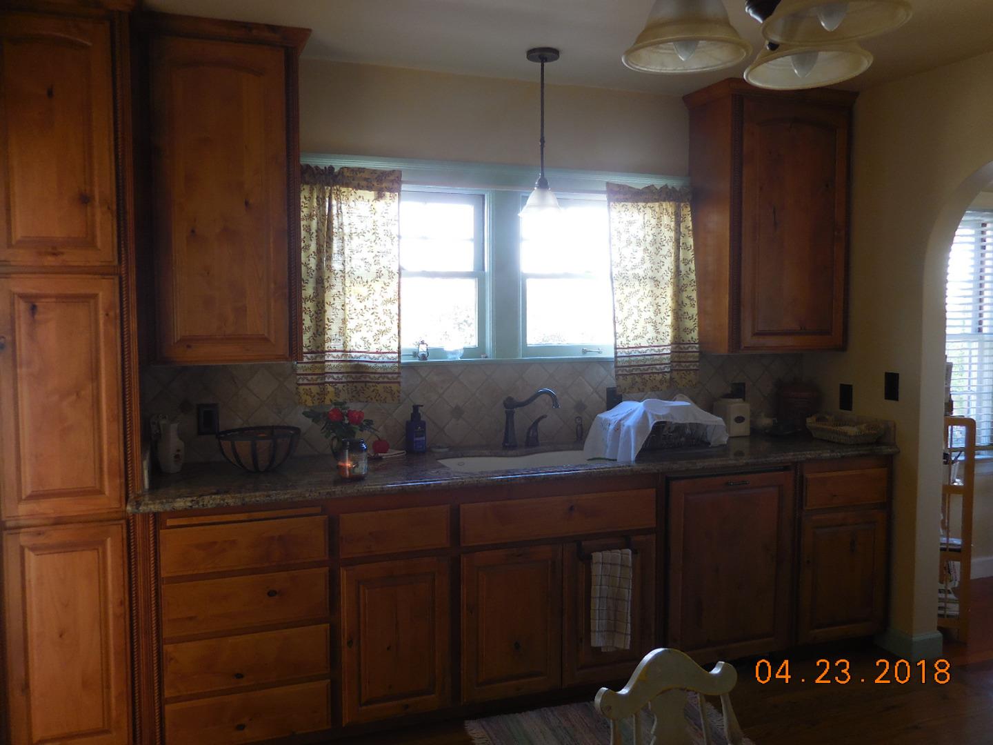 118 Willow Street Salinas, CA 93901 - Photo 11 of 24 a kitchen with granite countertop a sink cabinets and window