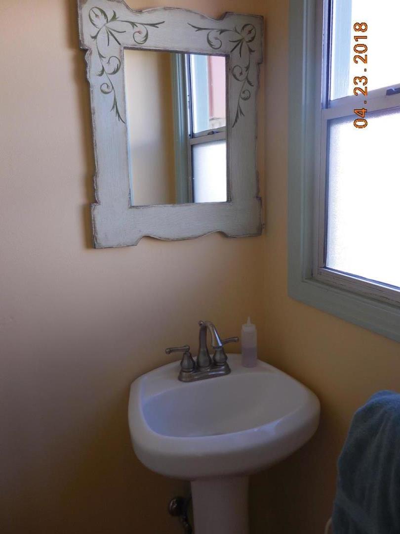 118 Willow Street Salinas, CA 93901 - Photo 14 of 24 a bathroom with a sink and a mirror