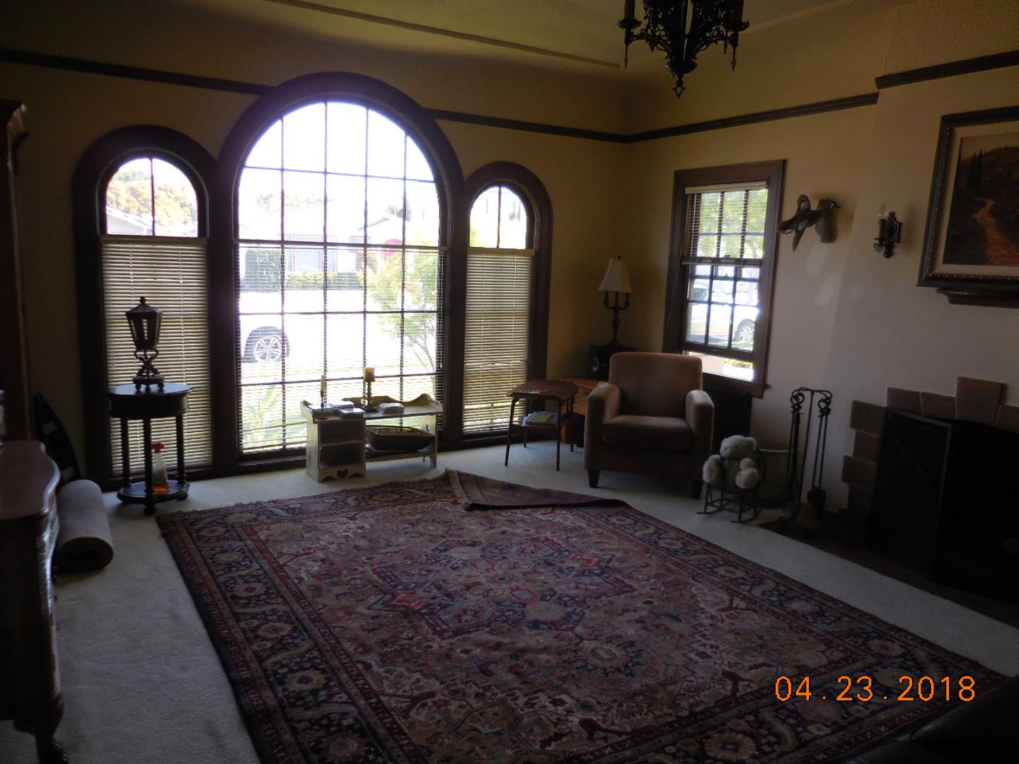 118 Willow Street Salinas, CA 93901 - Photo 20 of 24 a living room with furniture and a floor to ceiling window