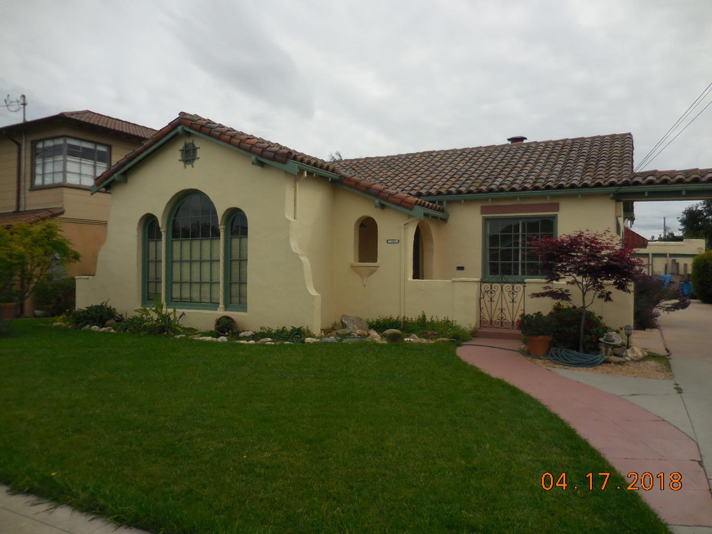 118 Willow Street Salinas, CA 93901 - Photo 4 of 24 a front view of a house with a garden