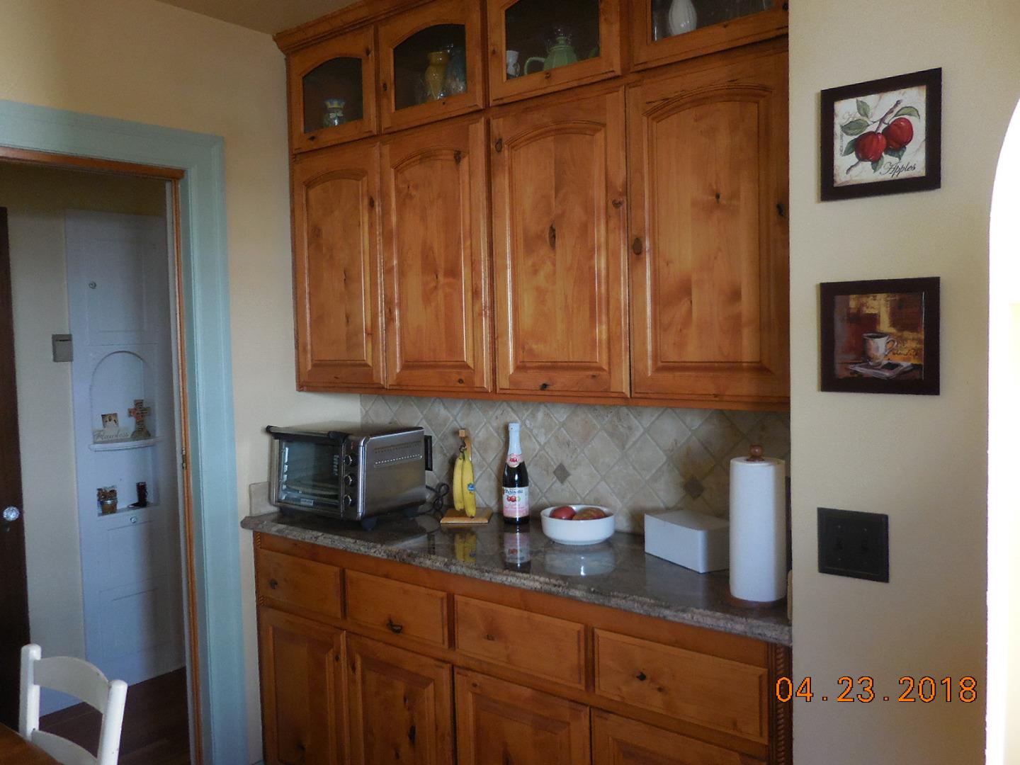 118 Willow Street Salinas, CA 93901 - Photo 10 of 24 a kitchen with stainless steel appliances granite countertop a refrigerator and cabinets
