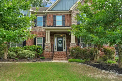 front view of a house with a garden