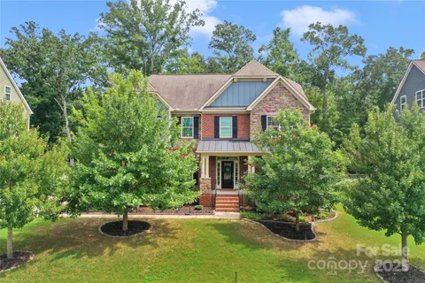 a front view of a house with yard