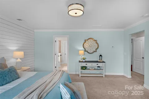 a living room with couch and a large mirror on a dresser