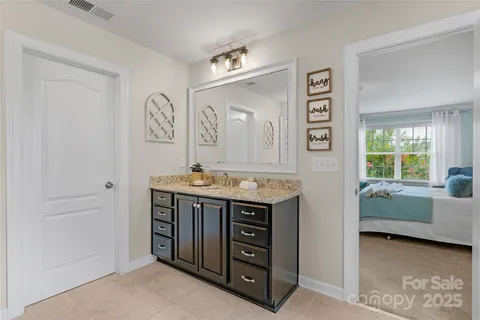 a view of room with window and bathroom
