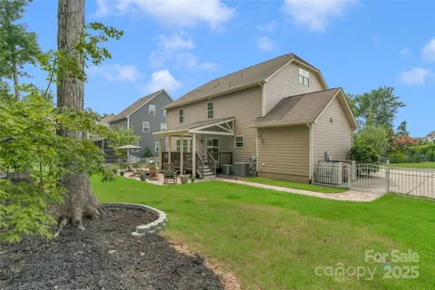 a front view of house with a garden and patio