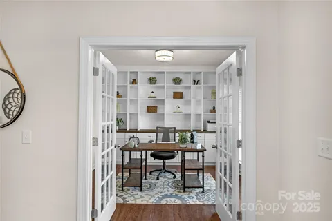a view of a livingroom with furniture and a window