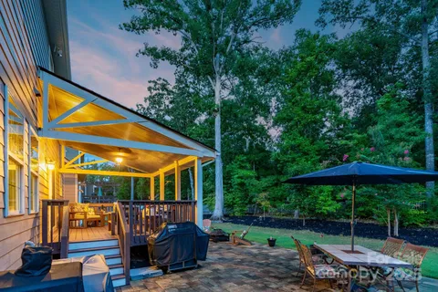 a view of backyard with patio