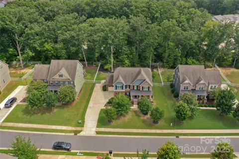an aerial view of a house with garden