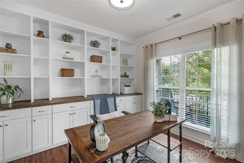a view of a kitchen with a table and chairs