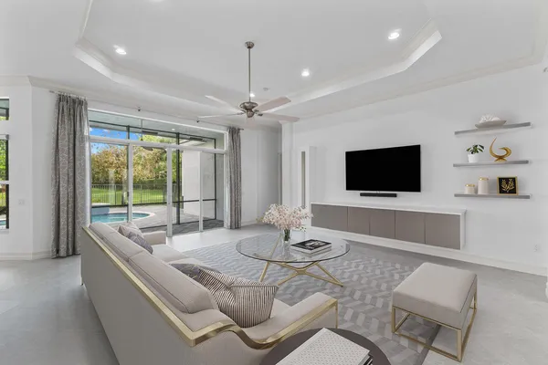 a living room with furniture and a flat screen tv