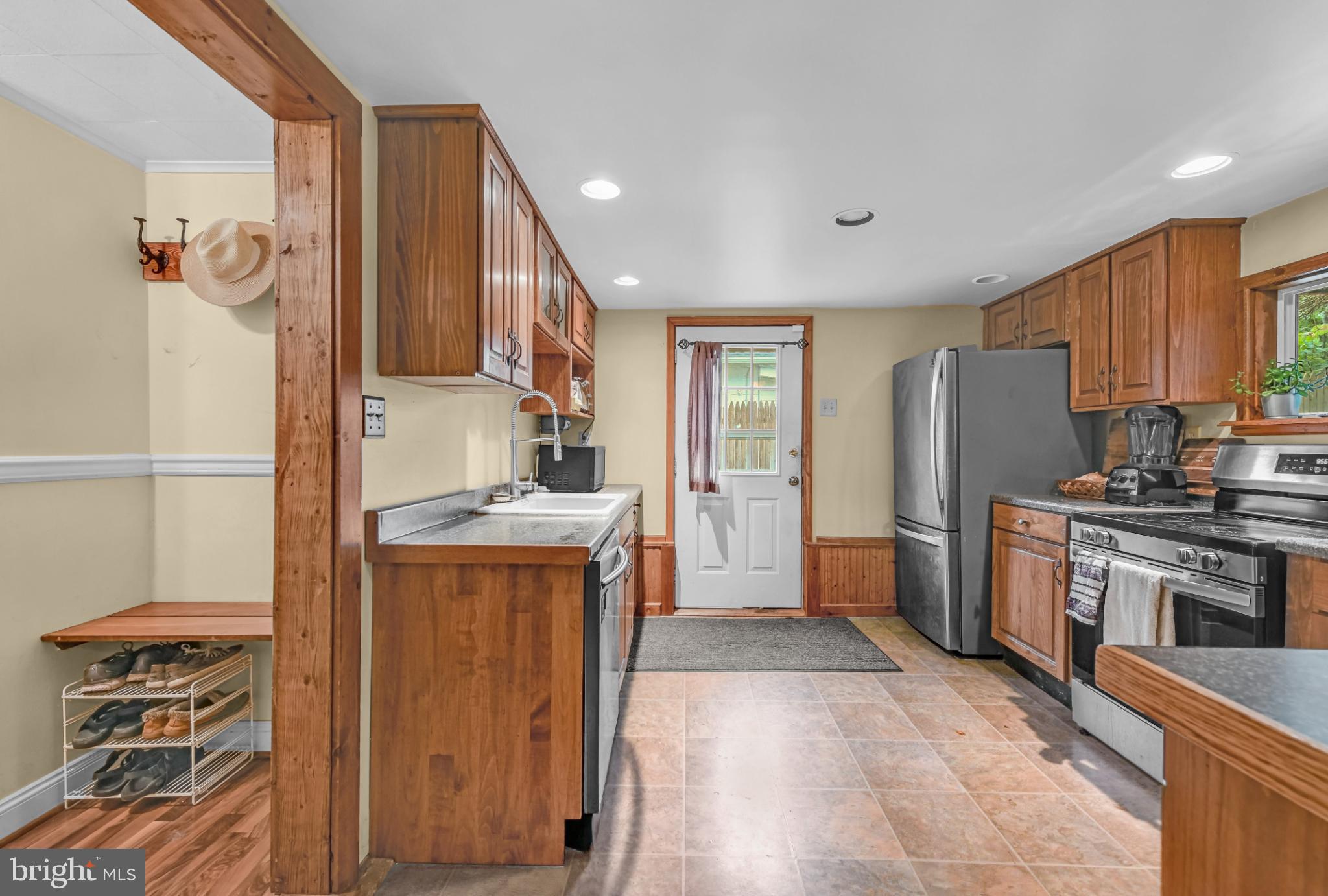 328 Funston Avenue Reading, PA 19607 - Photo 17 of 38 a kitchen with stainless steel appliances granite countertop a refrigerator a stove and a sink