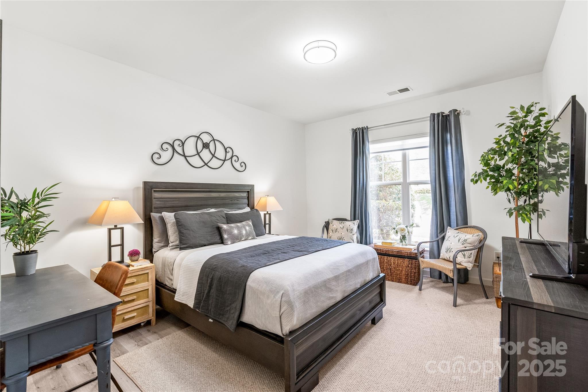 12357 Copper Mountain Boulevard Charlotte, NC 28277 - Photo 15 of 36 a bedroom with a bed and a table in it