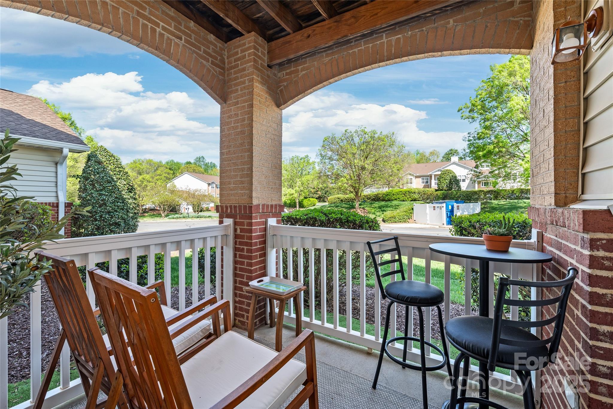 12357 Copper Mountain Boulevard Charlotte, NC 28277 - Photo 2 of 36 a view of a chair and table in the patio