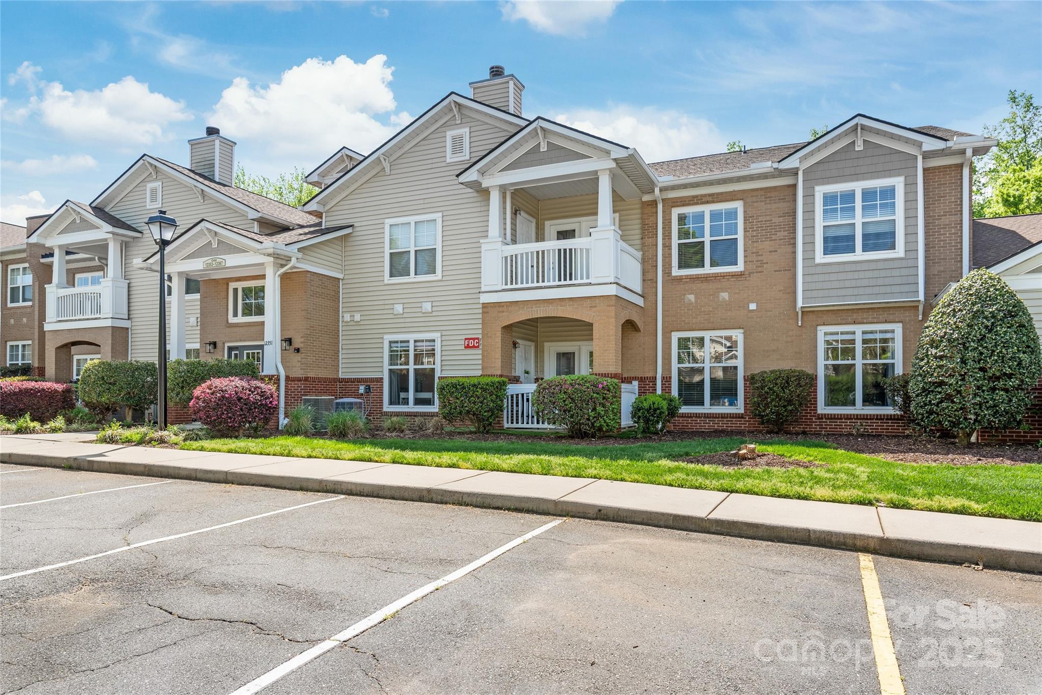 12357 Copper Mountain Boulevard Charlotte, NC 28277 - Photo 25 of 36 front view of a house with a yard