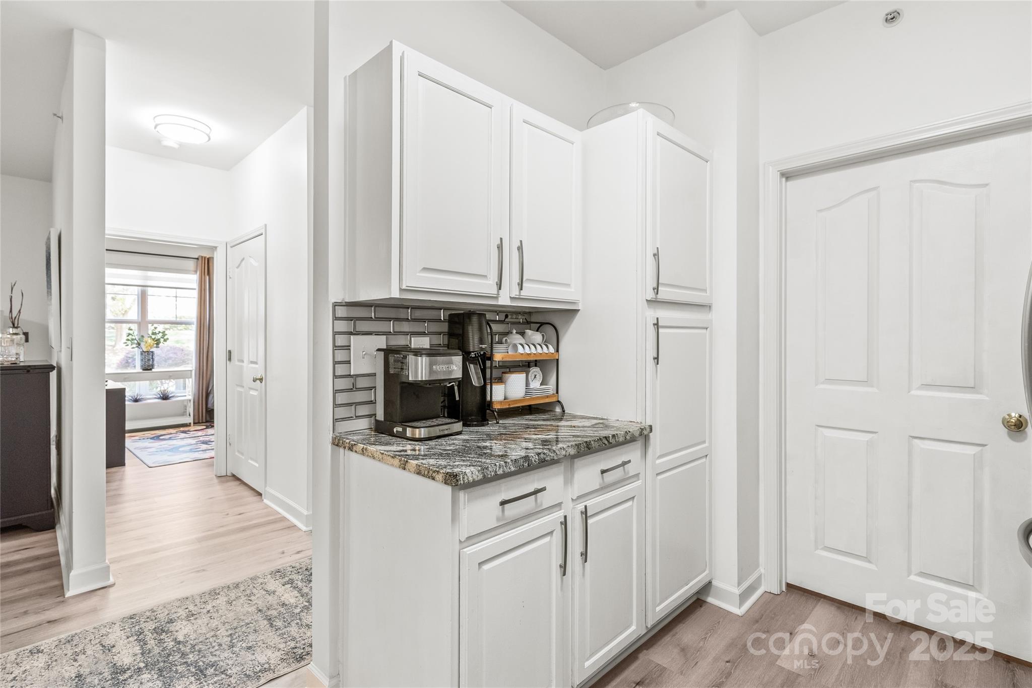 12357 Copper Mountain Boulevard Charlotte, NC 28277 - Photo 7 of 36 a kitchen with stainless steel appliances granite countertop a stove a refrigerator and a microwave