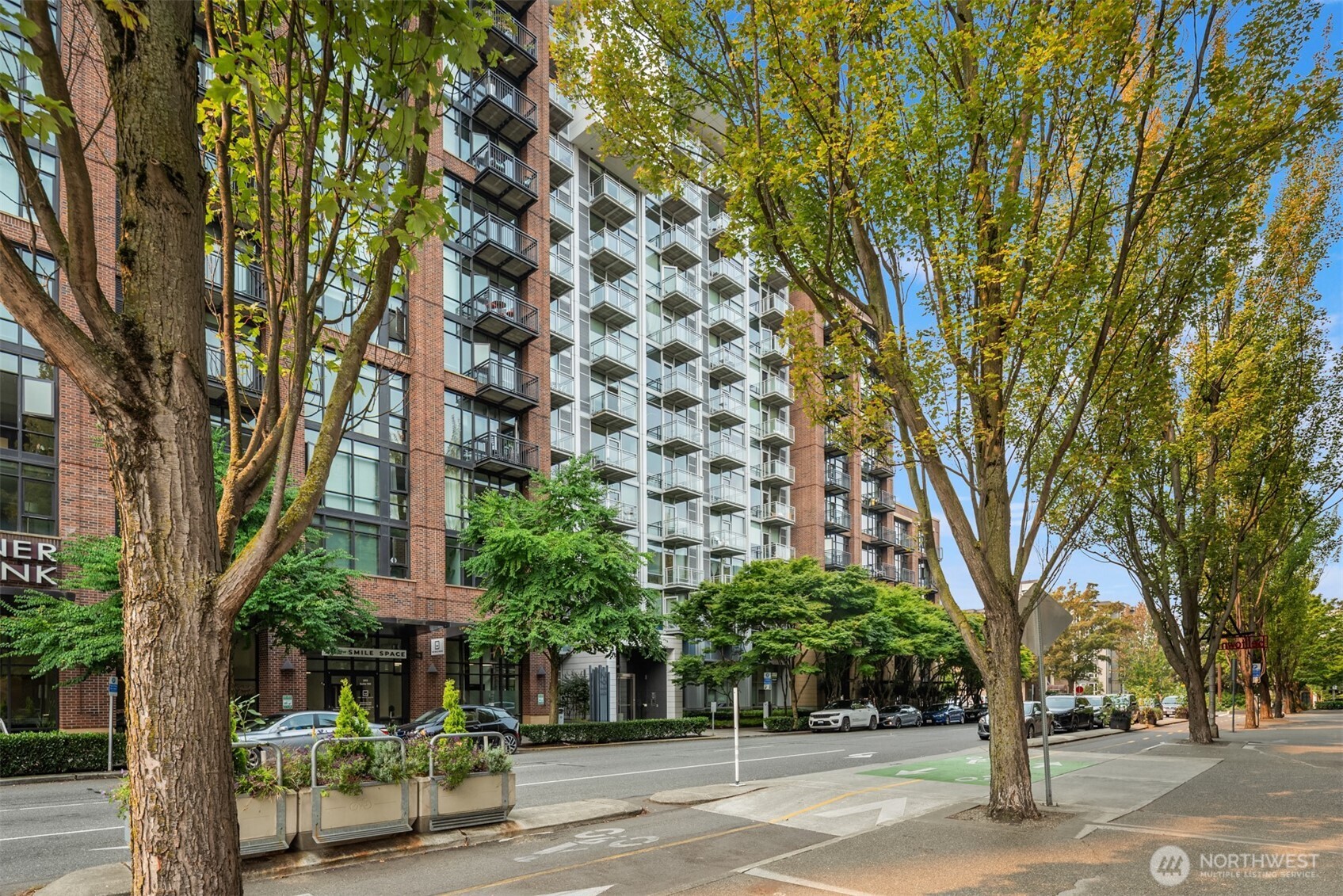 2911 2nd Avenue, Unit 310 Seattle, WA 98121 - Photo 38 of 40 front view of a building with trees