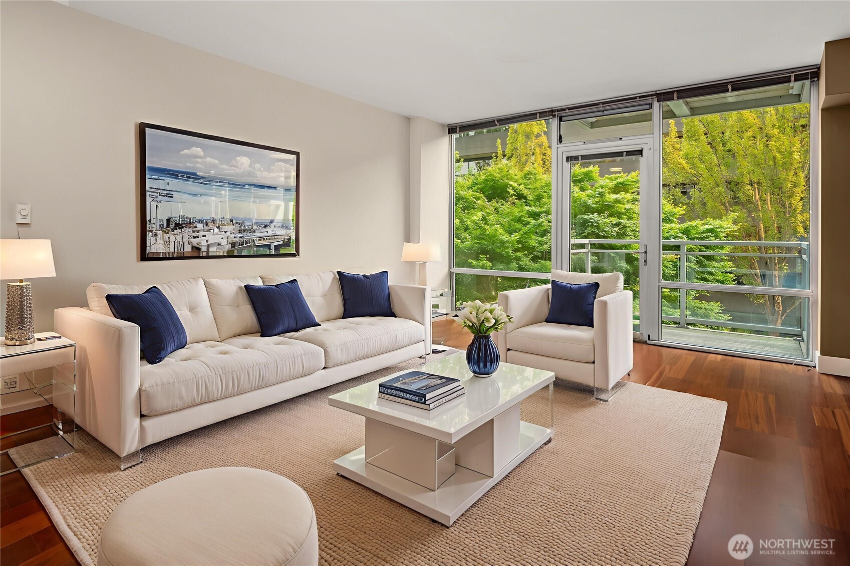2911 2nd Avenue, Unit 310 Seattle, WA 98121 - Photo 4 of 40 a living room with furniture and a large window