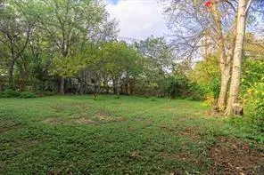 a view of outdoor space with deck and yard