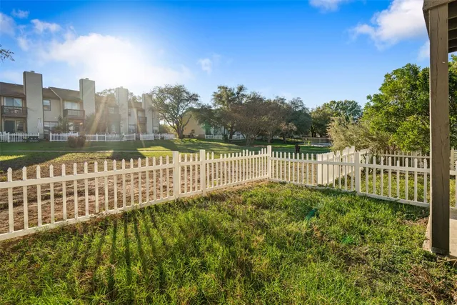 a view of a pathway with a garden
