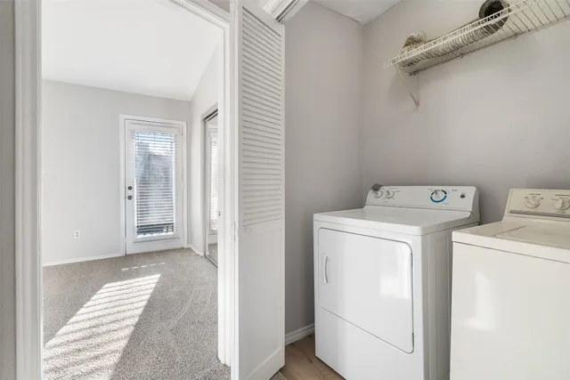 a view of storage and utility room with washer and dryer