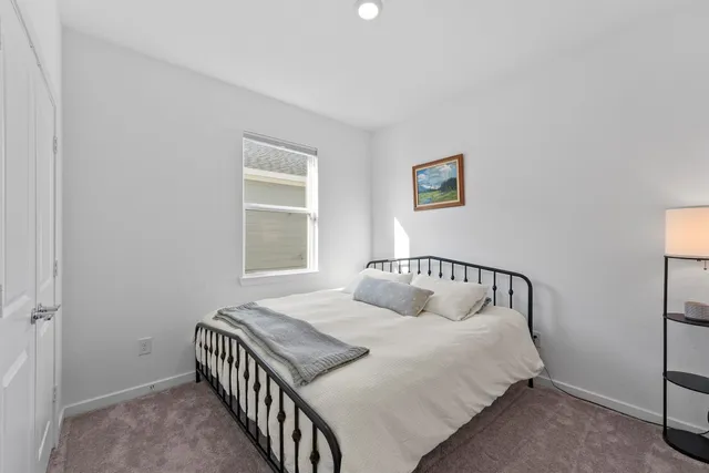 a view of a workspace with furniture and a bedroom