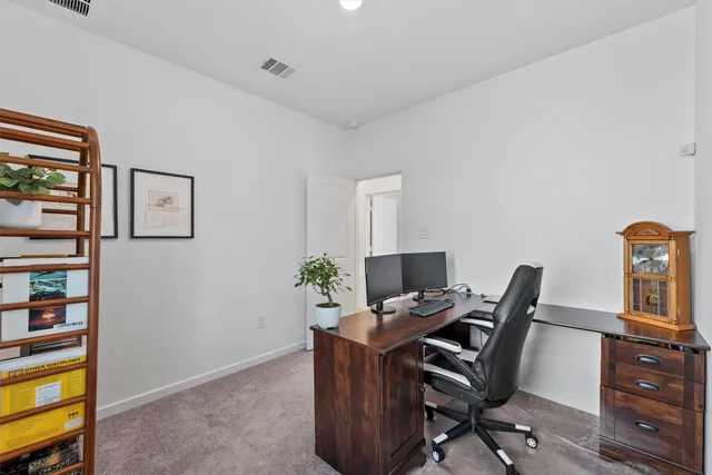a view of backyard with outdoor seating a patio and a garden