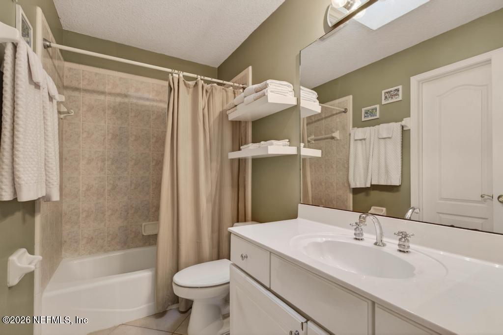 1483 Bridgette Way Fleming Island, FL 32003 - Photo 49 of 63 a bathroom with a sink toilet and shower
