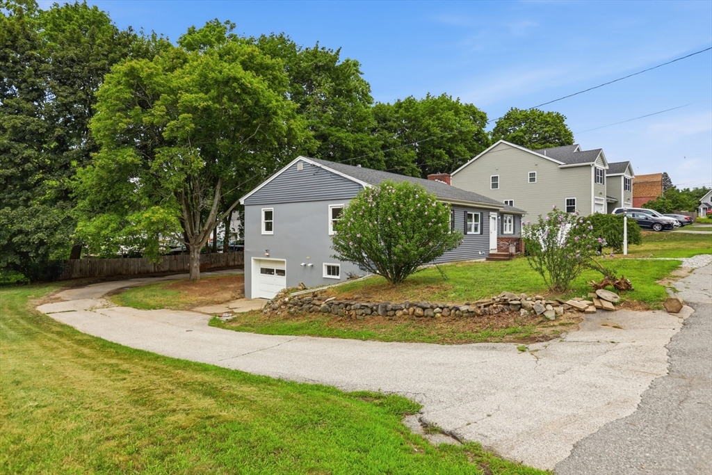 1007 Boston Road Haverhill, MA 01835 - Photo 22 of 32 a front view of a house with a yard