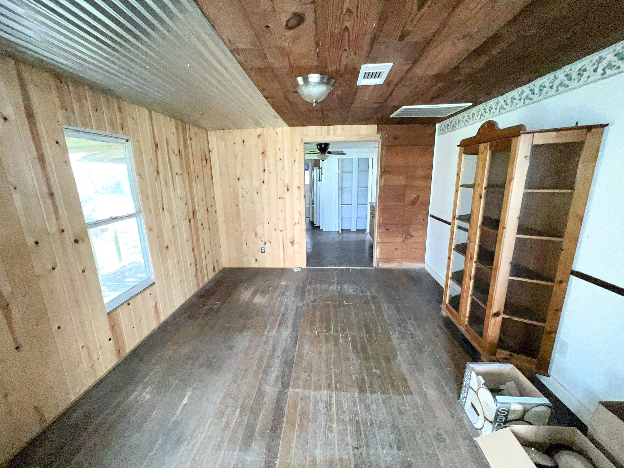 38440 Fisk Lane Pattison, TX 77423 - Photo 17 of 34 a view of empty room with wooden floor and fan