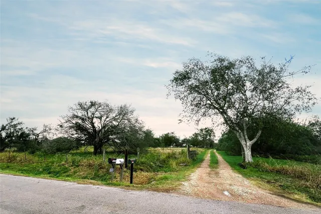 a view of a lake with a yard