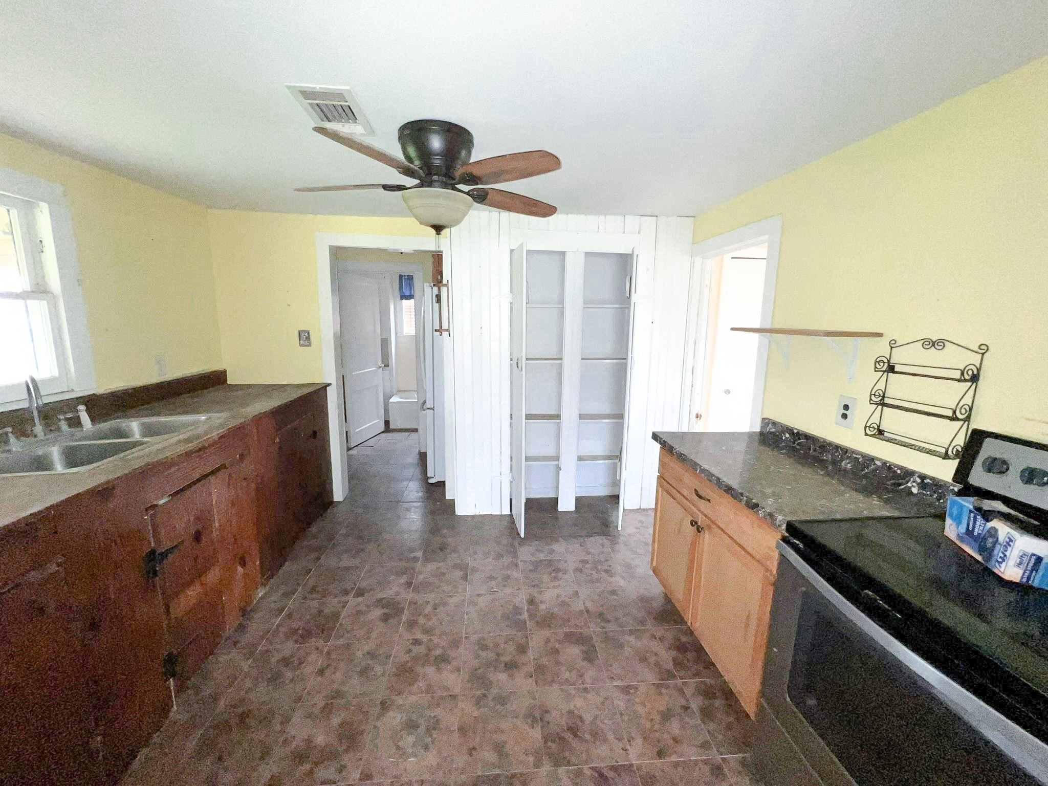 38440 Fisk Lane Pattison, TX 77423 - Photo 32 of 34 a kitchen with stainless steel appliances granite countertop a sink and a stove