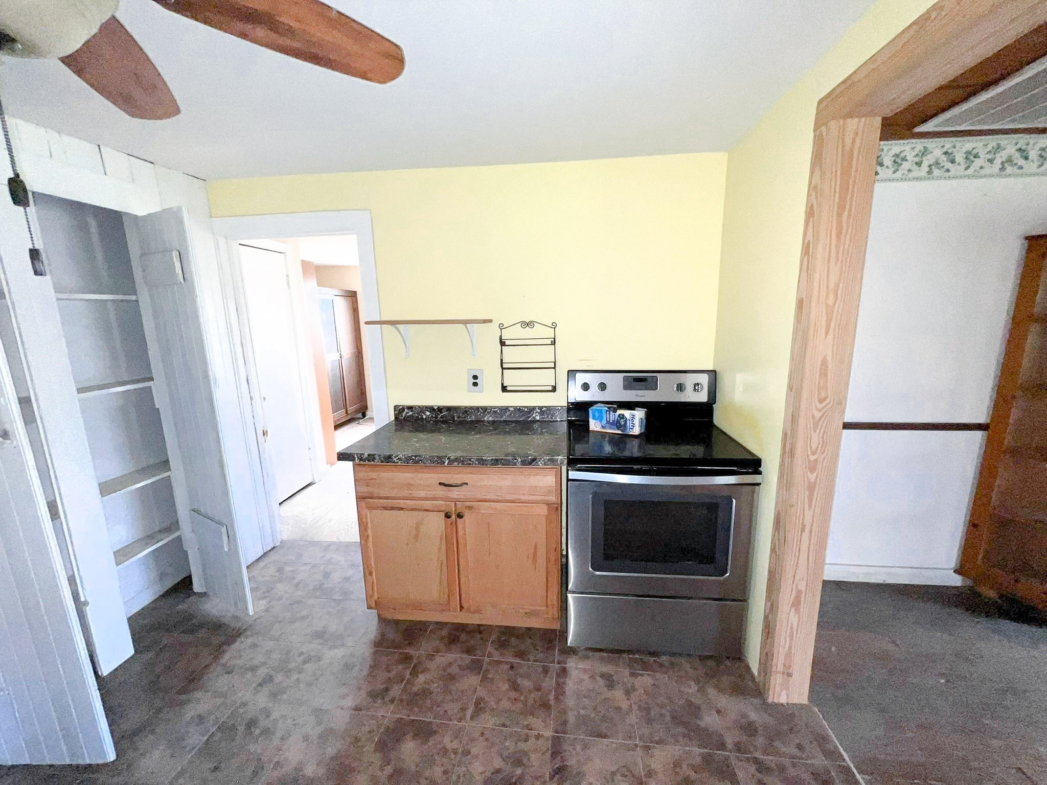 38440 Fisk Lane Pattison, TX 77423 - Photo 33 of 34 a kitchen with stainless steel appliances granite countertop a refrigerator a stove and a sink